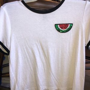 White T-shirt with a sequence watermelon slice.